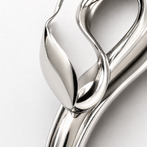 Macro detail of the AUVYR Serpent Flow Pendant on #F9F9F9 background